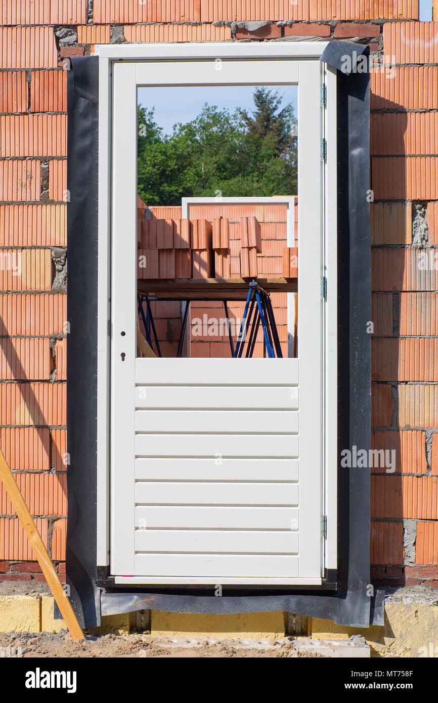 Construction site with door frame in wall Stock Photo