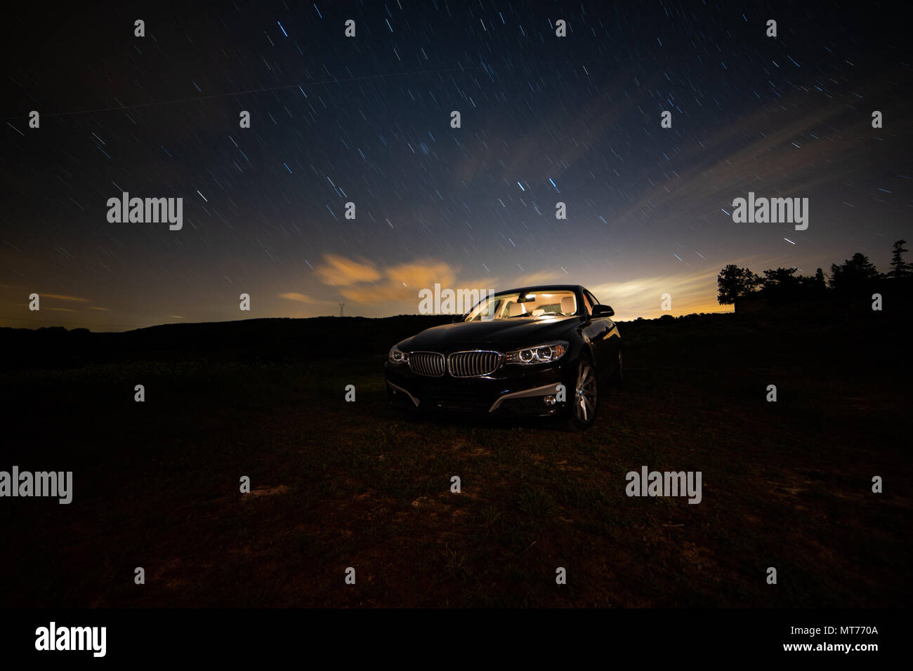 Long Night Photography Of A Car With White Color Illuminated