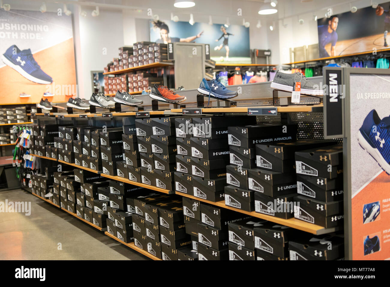 Under Armour running shoes for sale at the Tanger outlet mall in Deer Park Long Island, New York. Stock Photo