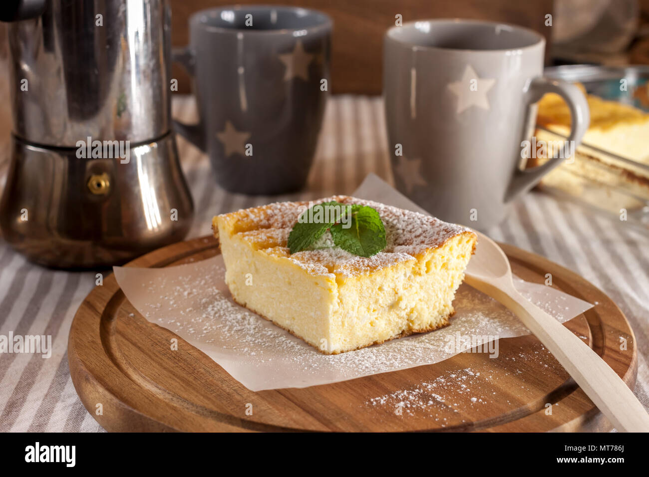 appetizing cottage cheese casserole and cups Stock Photo
