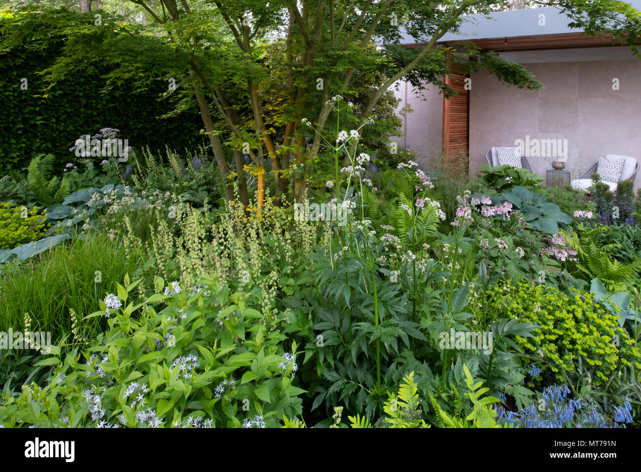 A wide variety of plants surrounding a pavilion in the Morgan Stanley Garden for the NSPCC designed by Chris Beardshaw and winner of the Best Show Gar Stock Photo