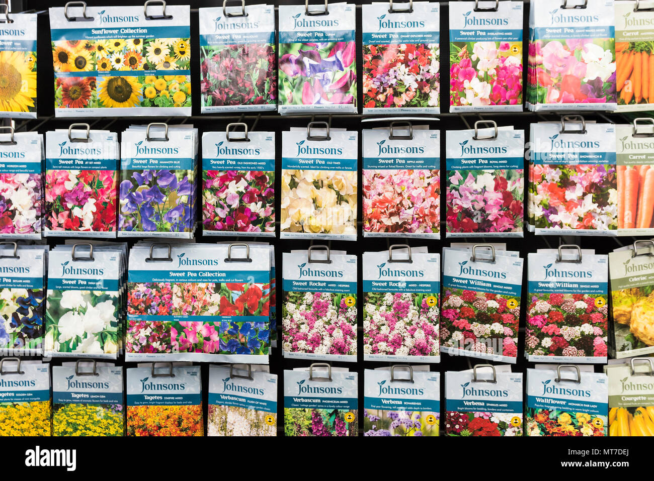 Packets of flower seeds on sale in a garden centre. Stock Photo