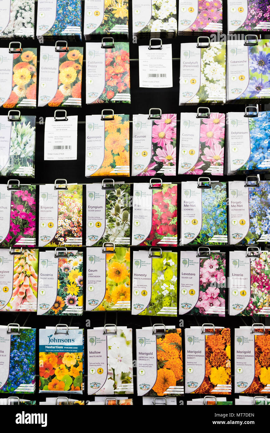 Packets of flower seeds on sale in a garden centre. Stock Photo