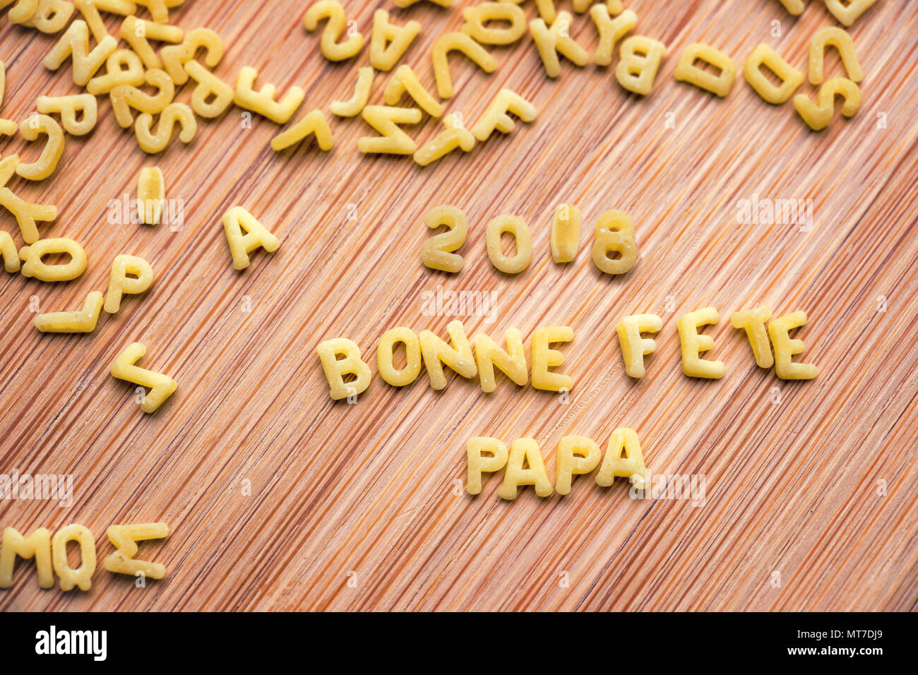 Pasta forming the text 2018 Bonne Fete Papa, meaning Happy Fathers Day in French Stock Photo