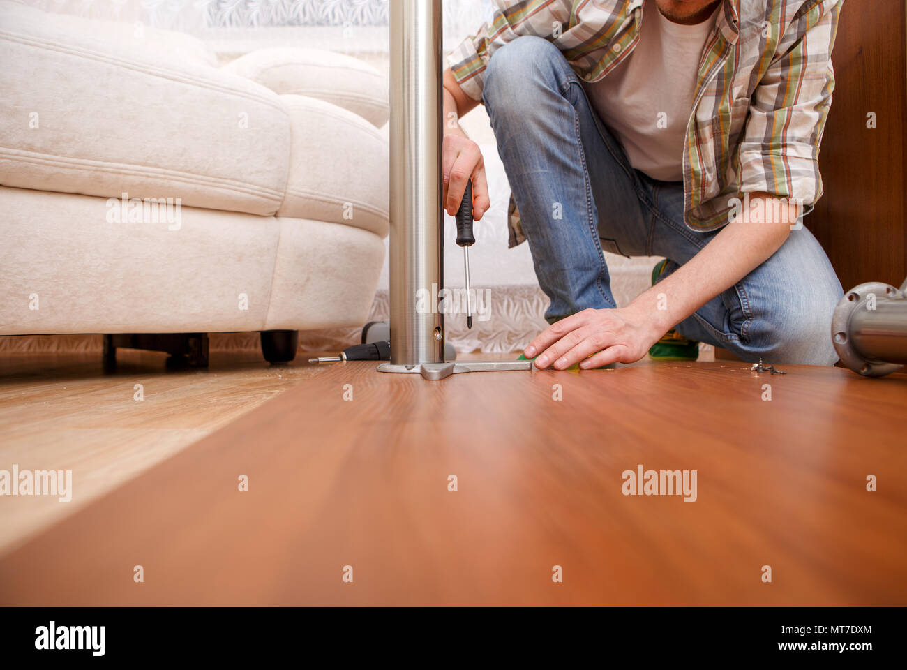 Picture of man picking furniture Stock Photo Alamy