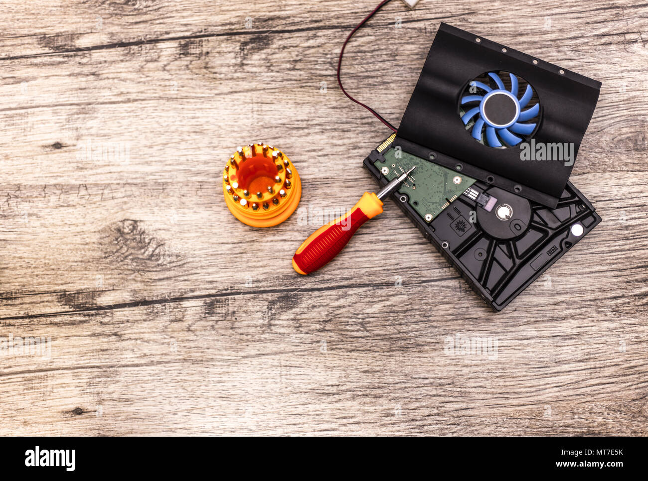 cooler on hard disk with screwdriver bits. Stock Photo