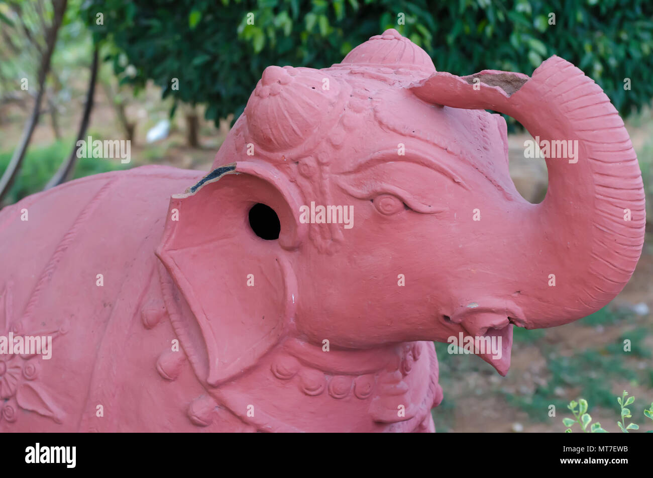 A damaged teracotta elephant at Shilparamam arts and crafts village in Hyderabad, India. Image signifies defect, damage, flaw, spoil or imperfection. Stock Photo