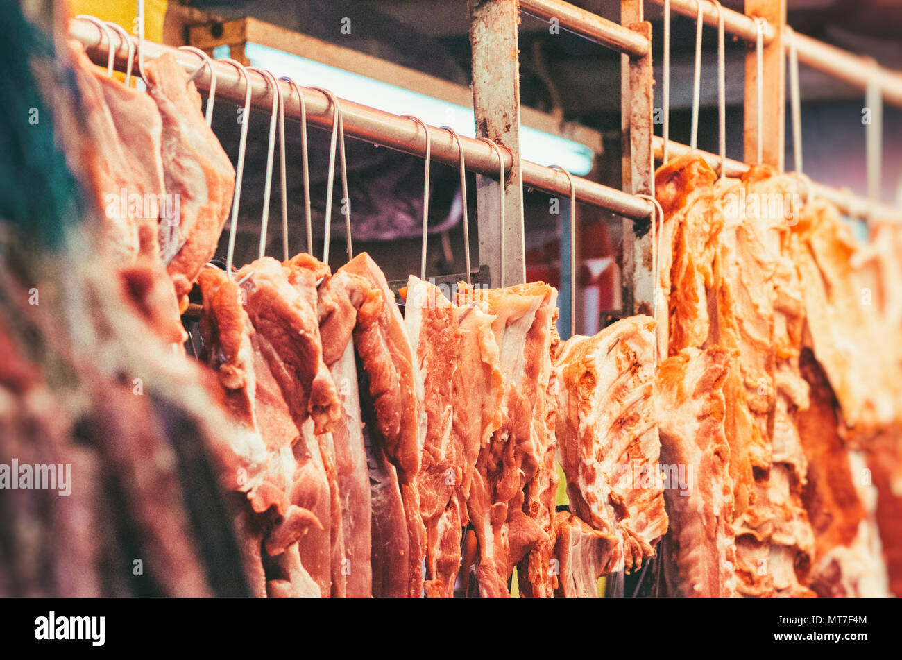 Butcher selling pork in Hong Kong market Stock Photo Alamy