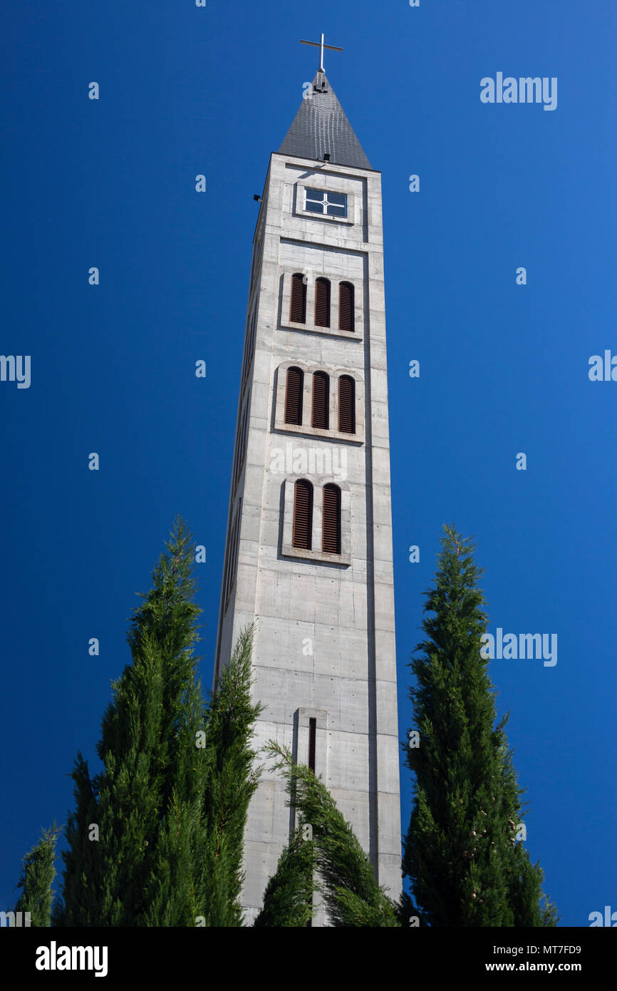 The campanile of the Saint Peter and Paul Franciscan church, at Mostar (Bosnia-Herzegovina). Wiped out in 1992, the church has been rebuilt since then Stock Photo