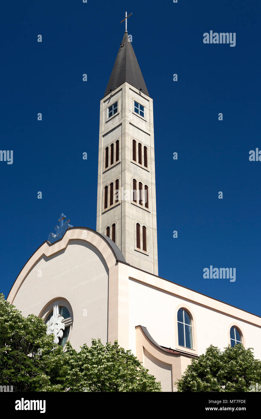 The campanile of the Saint Peter and Paul Franciscan church, at Mostar (Bosnia-Herzegovina). Wiped out in 1992, the church has been rebuilt since then Stock Photo