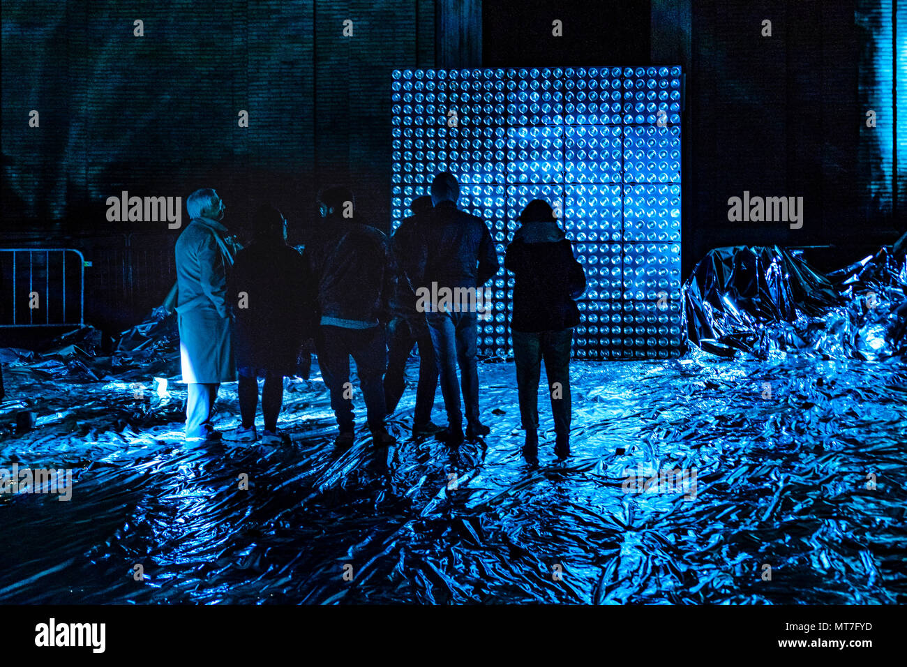 Night scene high contrast photo of people at outdoor contemporary art lights  and music performance in Rome city, Italy Stock Photo - Alamy