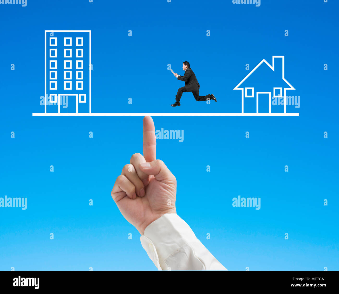 Office and home on seesaw with index finger to balance, one businessman running on Stock Photo
