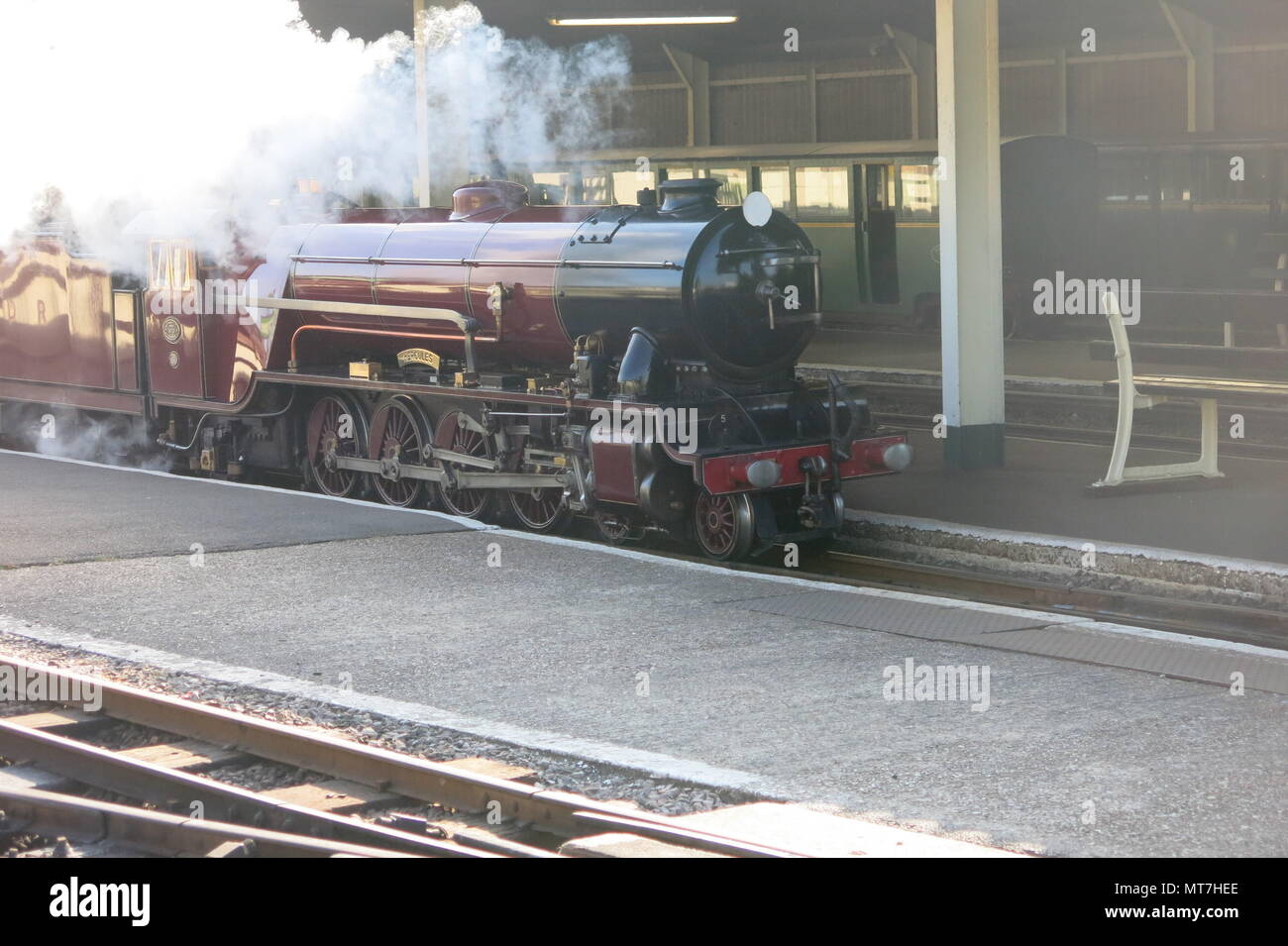 The steam locomotive Hercules arriving at New Romney station: Romney, Hythe & Dymchurch steam railway, Kent Stock Photo