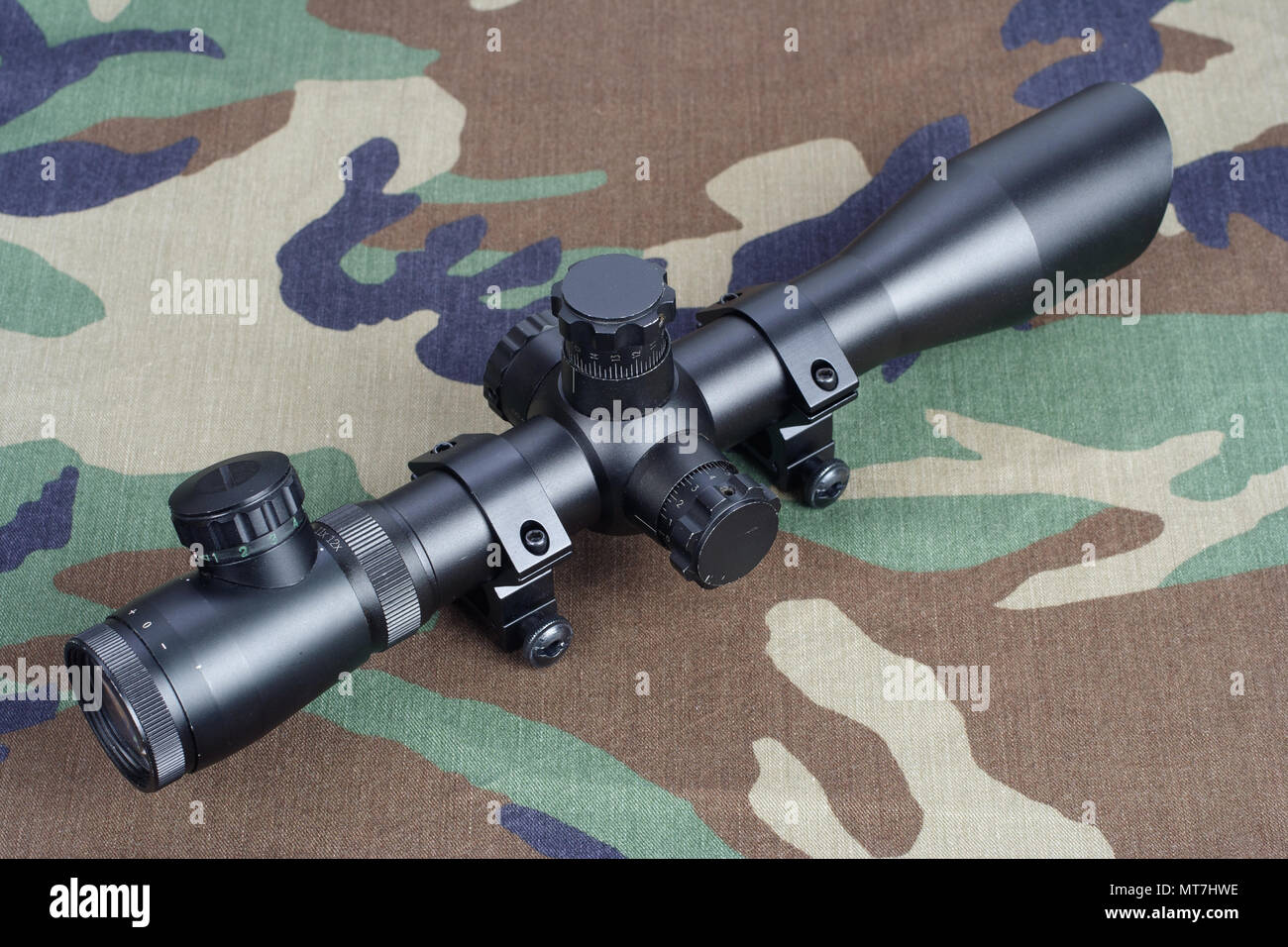 A Camouflaged Sniper Sitting In The Woods Aiming Through His Scope Stock  Photo, Picture and Royalty Free Image. Image 42659284.