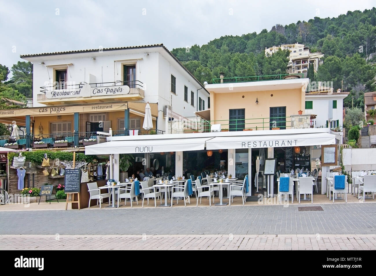 PUERTO SOLLER, MALLORCA, SPAIN - MAY 10, 2018: Souvenir shops and  restaurants in the marina on an overcast day on May 10, 2018 in Puerto  Soller, Mallo Stock Photo - Alamy