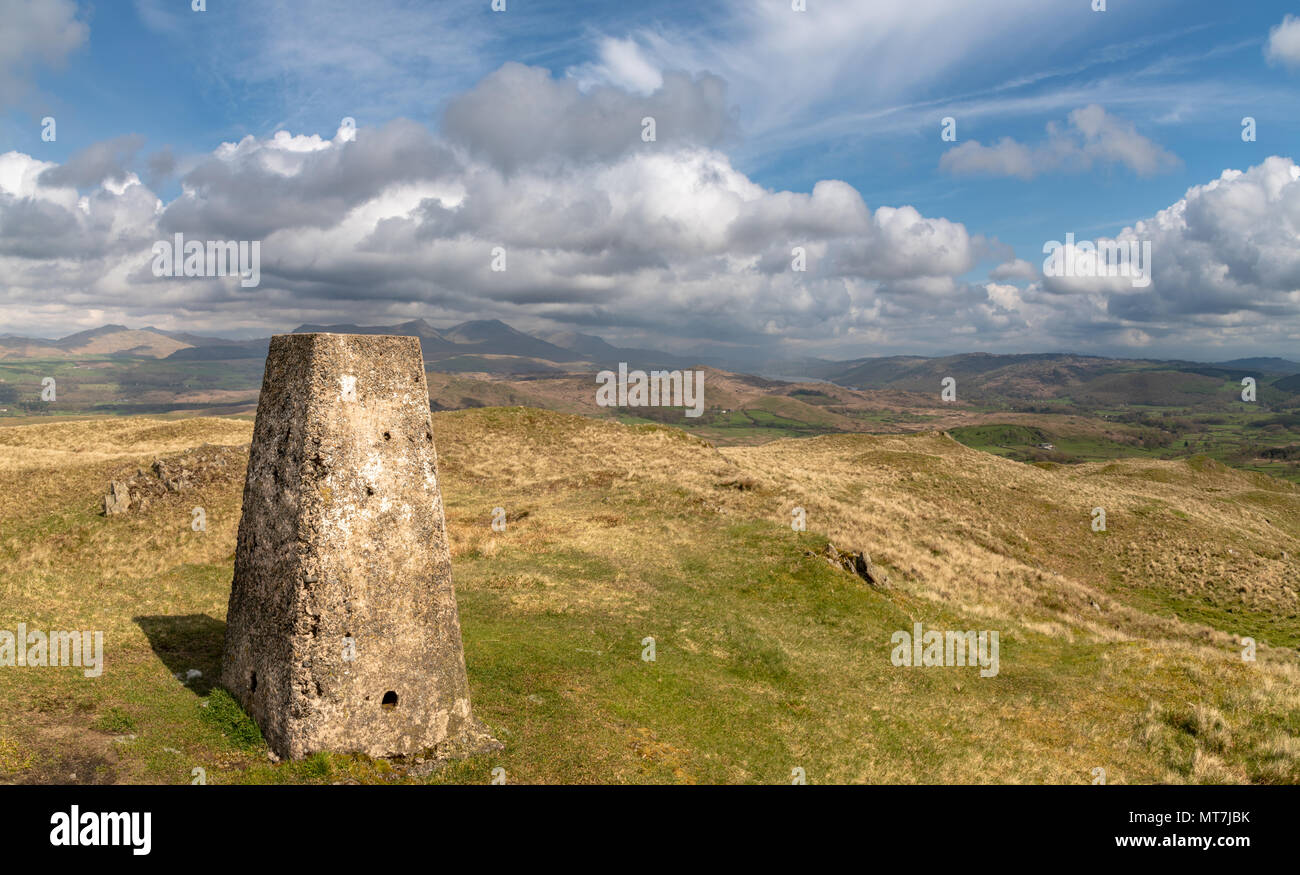 The trig point at the summit of Great Burney in the South Lake Distirct, Cumbria, UK with the furness fells beyond.  Nikon D850, Nikon 24-120 f4 VR @  Stock Photo