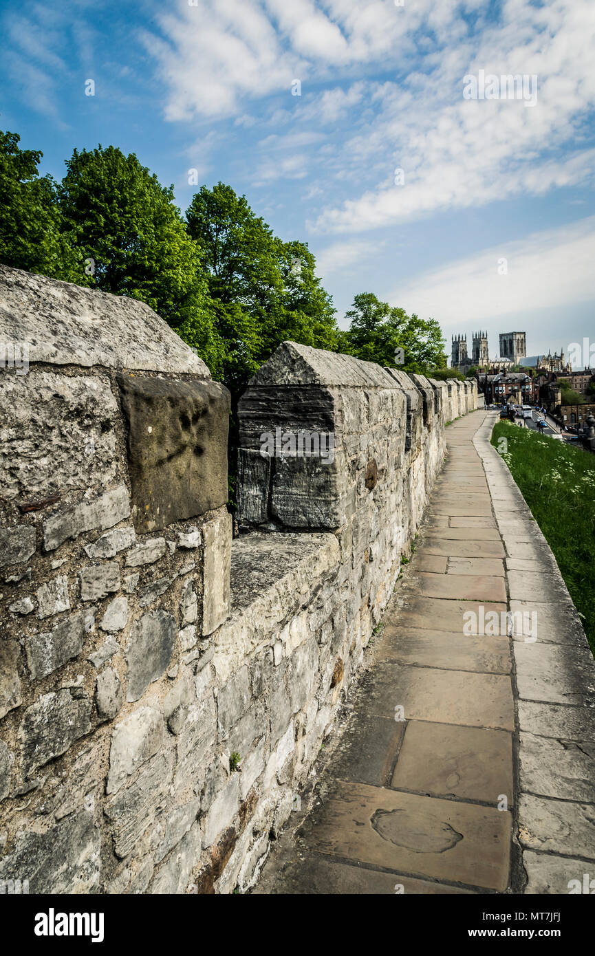 Street scene along the city wall ramparts looking toward York Minster in the city of York Stock Photo