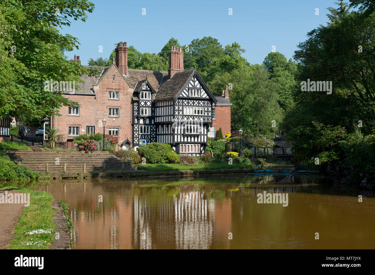 The Packet House is seen across the Bridgewater Canal in Worsley, Salford, Greater Manchester, UK. Stock Photo