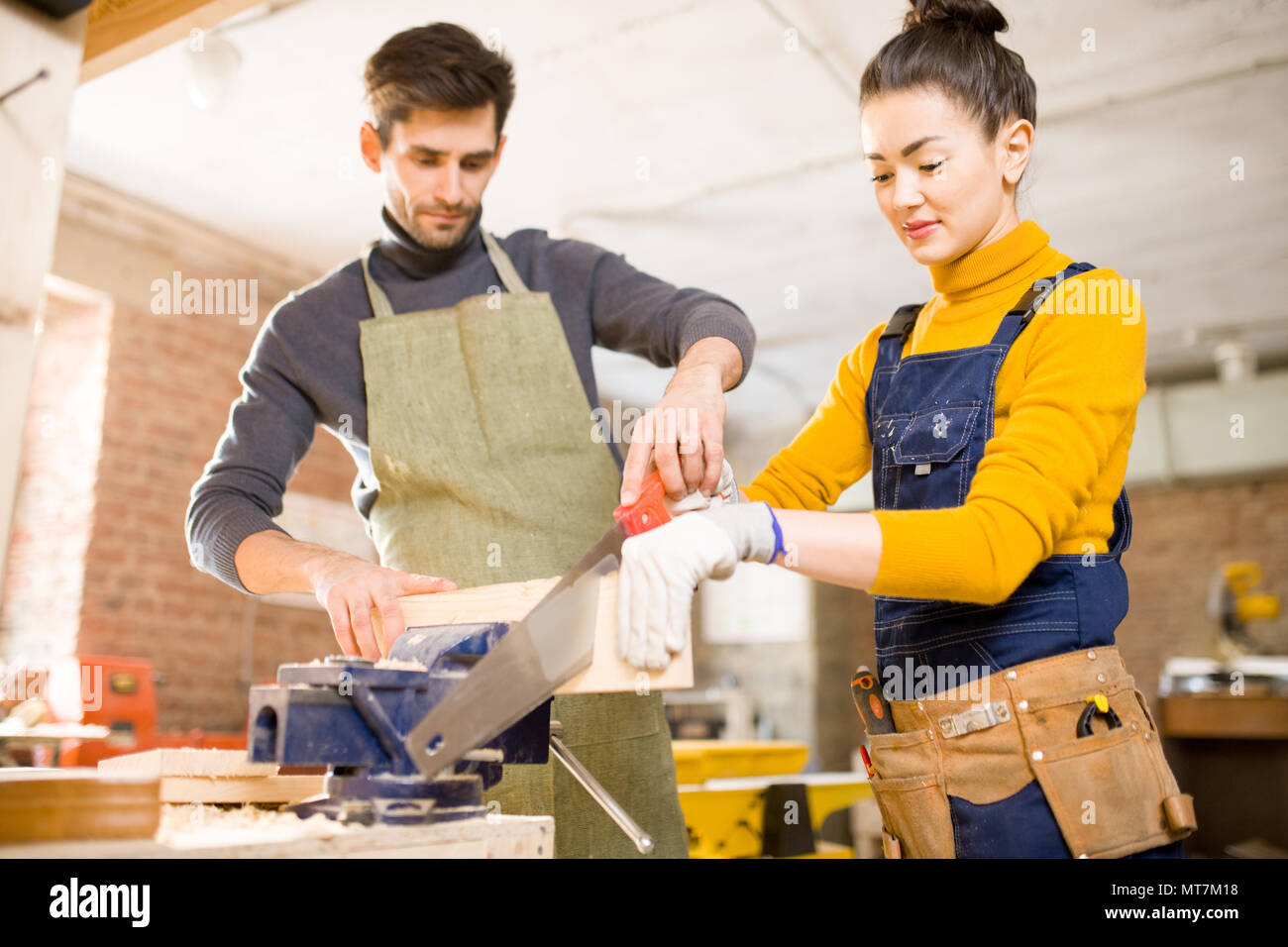 Modern Carpenters Cutting Wood Stock Photo - Alamy