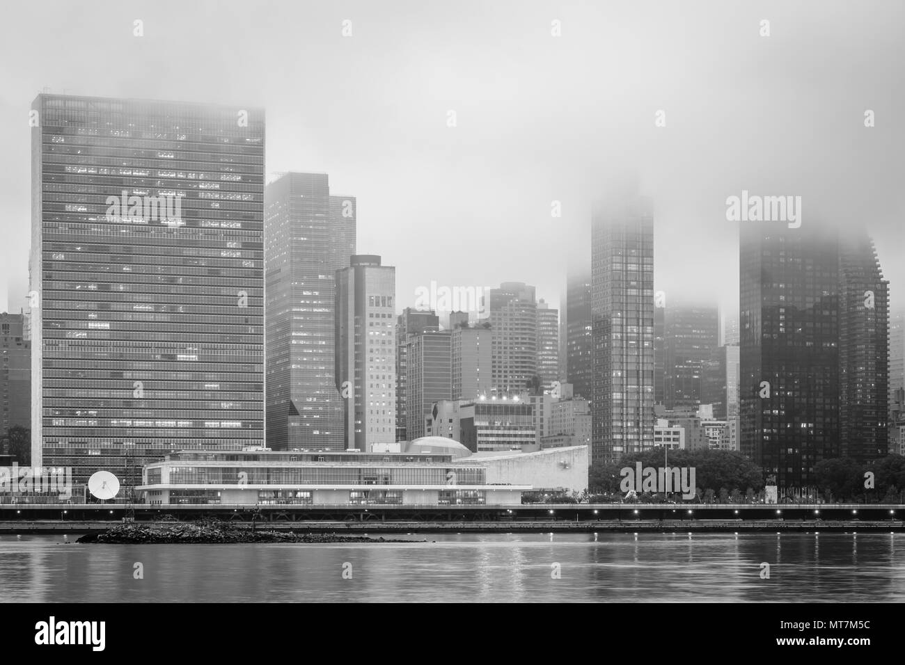 Foggy view of the Manhattan skyline from Gantry Plaza State Park, in