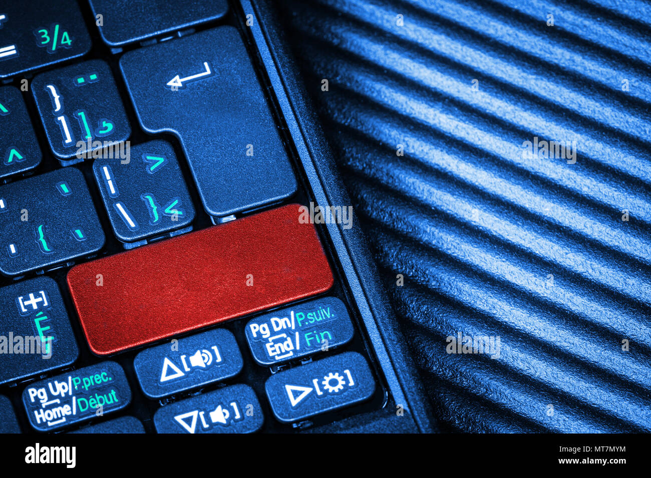 Close up of computer laptop keyboard with a blank red button for any message and copy space. Conceptual image of an alert, danger, warning, announceme Stock Photo