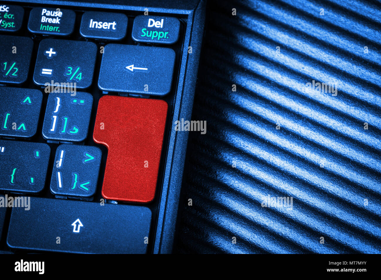 Close up of computer laptop keyboard with a blank red button for any message and copy space. Conceptual image of an alert, danger, warning, announceme Stock Photo
