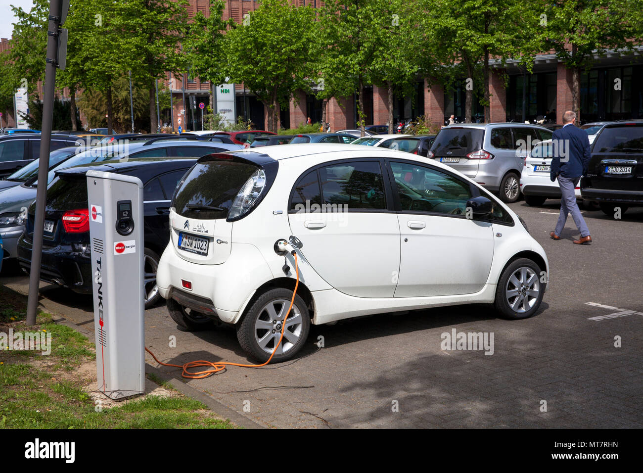 Citroën C-Zero at a charging station of the Mobilstation on the Charles-de-Gaulle square in the district Deutz, Cologne, Germany. With a direct connec Stock Photo