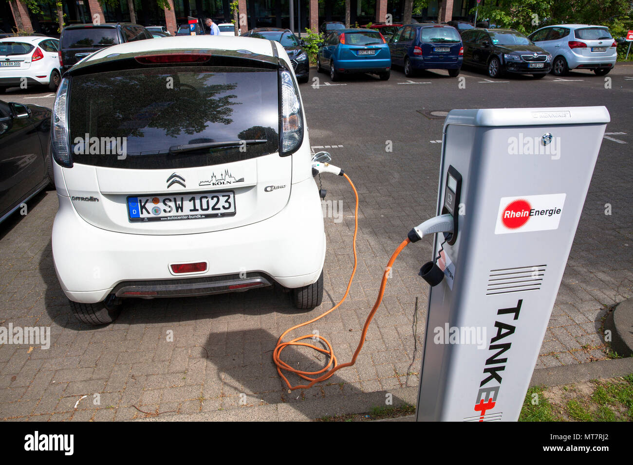 Citroën C-Zero at a charging station of the Mobilstation on the Charles-de-Gaulle square in the district Deutz, Cologne, Germany. With a direct connec Stock Photo