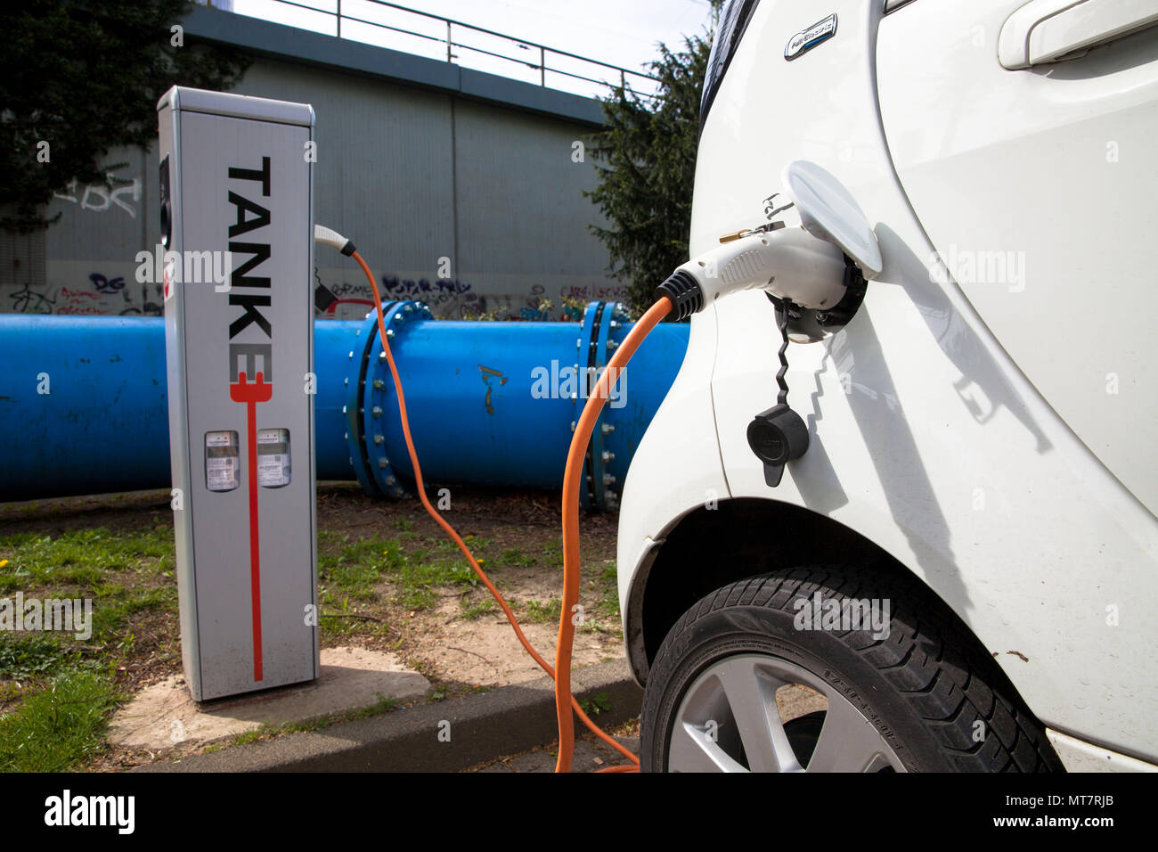 Citroën C-Zero at a charging station of the Mobilstation on the Charles-de-Gaulle square in the district Deutz, Cologne, Germany. With a direct connec Stock Photo