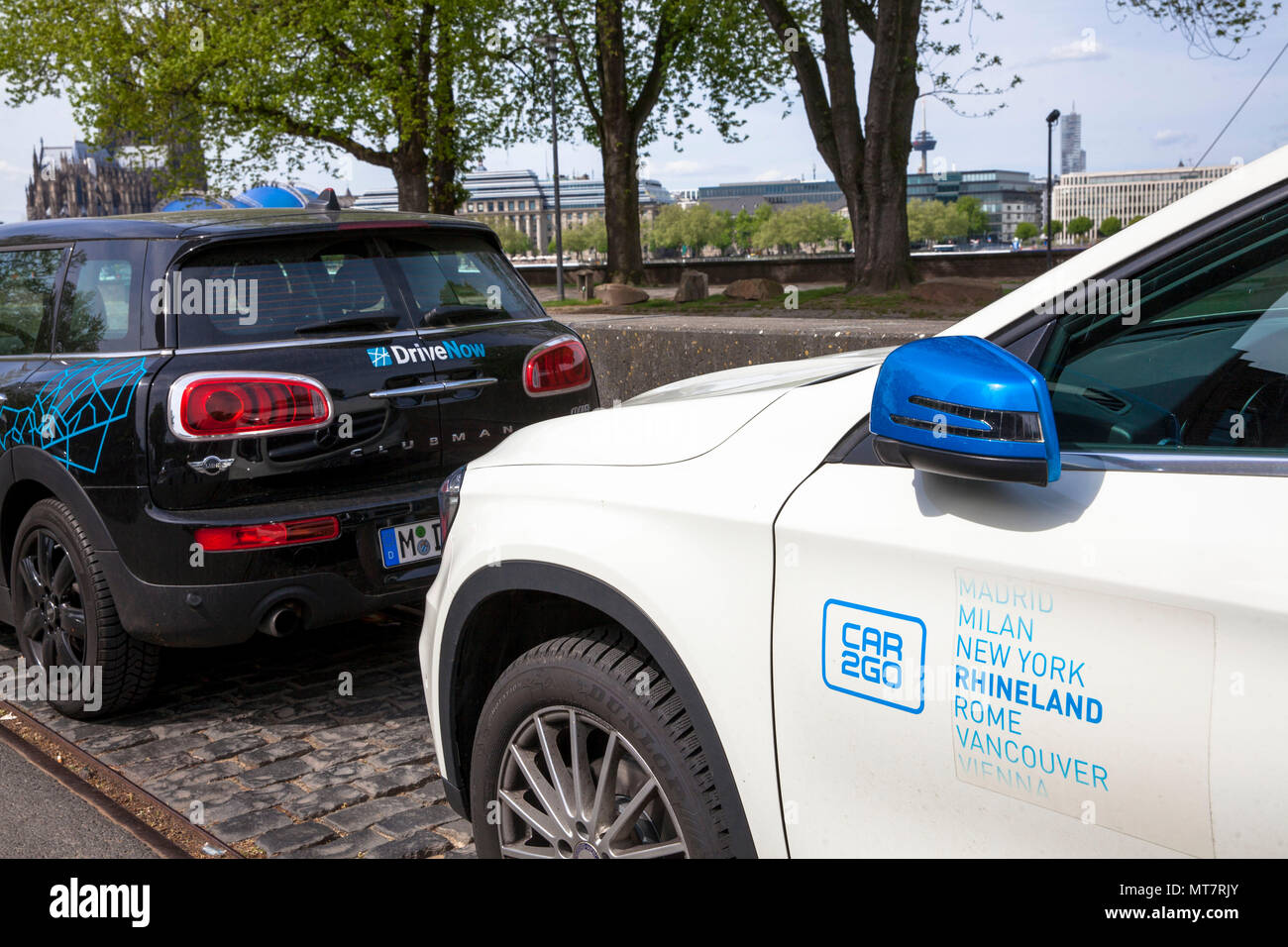 cars of the carsharing companies Drive Now and Car2Go in the district Deutz, Cologne, Germany. Stock Photo