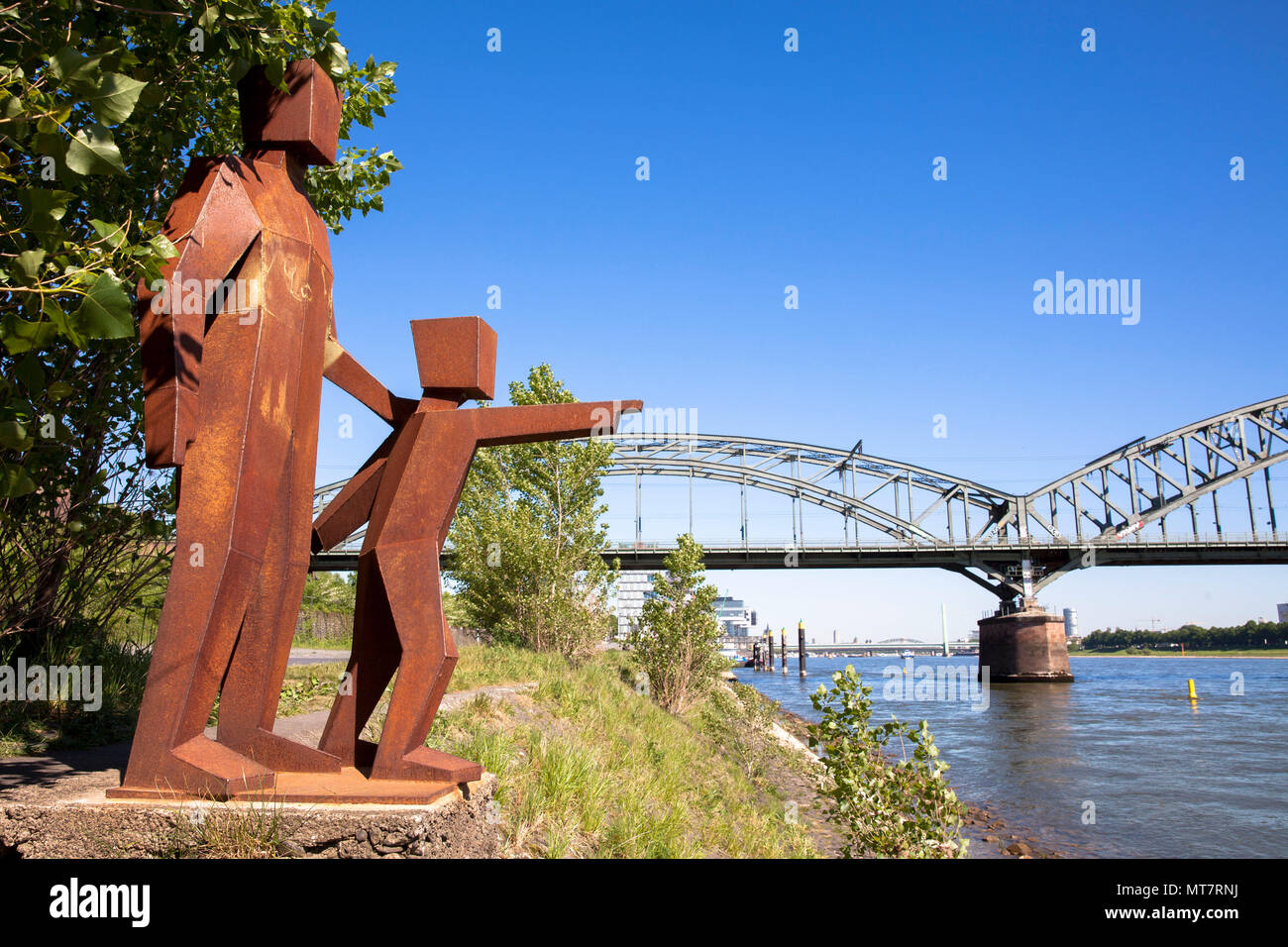 Germany, Cologne, the sculpture 'Son and Father' by an unknown artist on the banks of the river Rhine near the South bridge in the district Bayenthal. Stock Photo