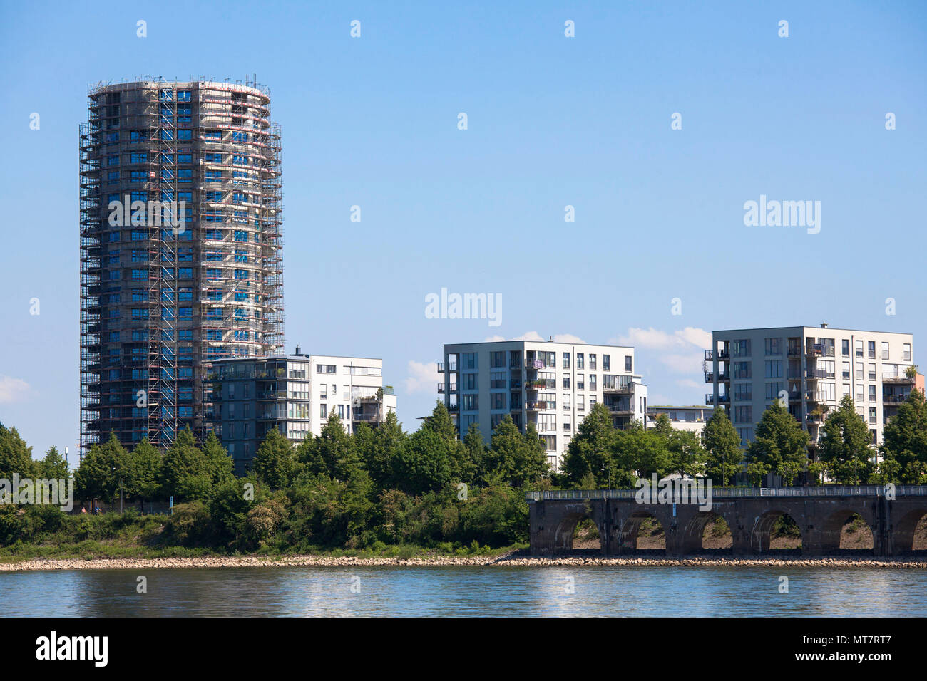 Germany, Cologne, apartment houses on the Stammheimer Ufer at the banks of the River Rhine in the district Muelheim, on the left the construction site Stock Photo