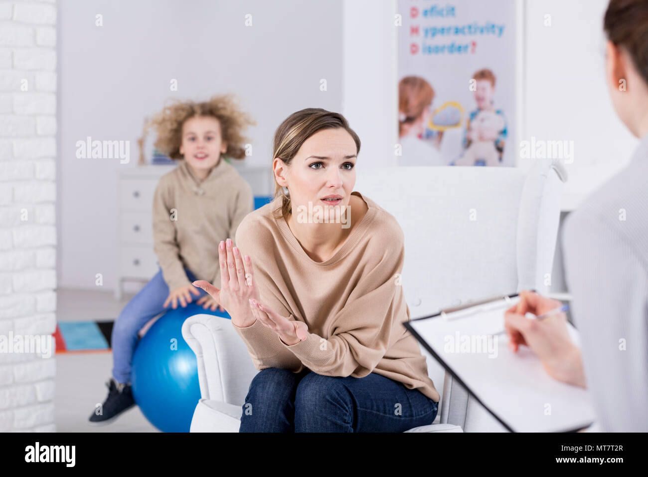 Mother helping her ADHD child, consulting problem with psychologist