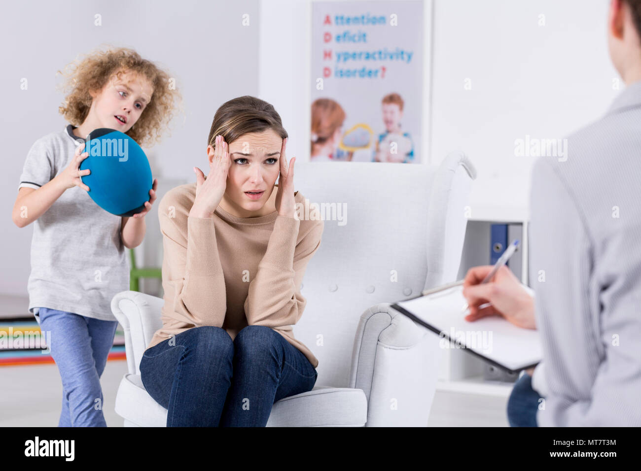 Helpless mother of ADHD child talking with psychologist Stock Photo Alamy