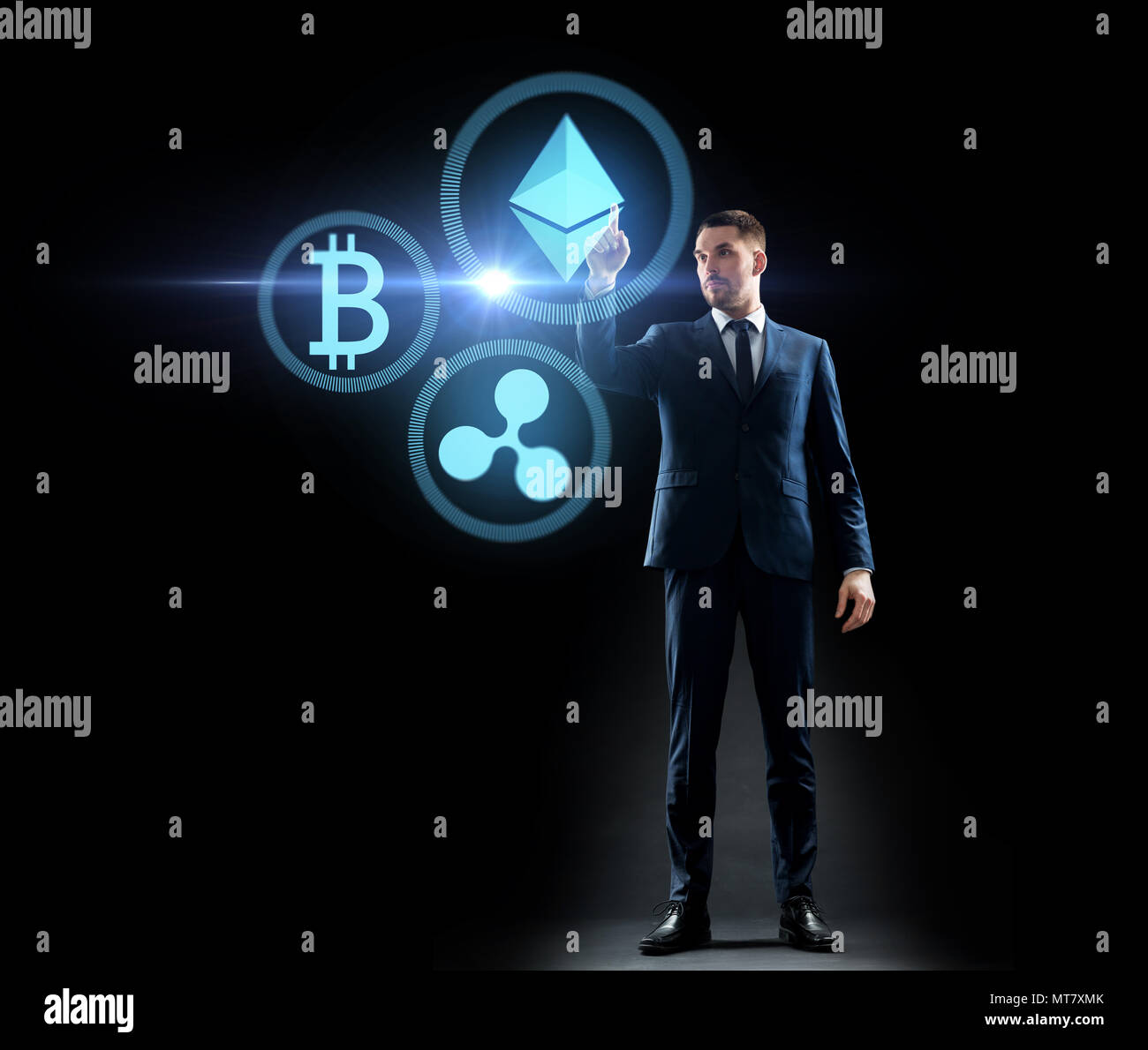 buisnessman with cryptocurrency holograms Stock Photo