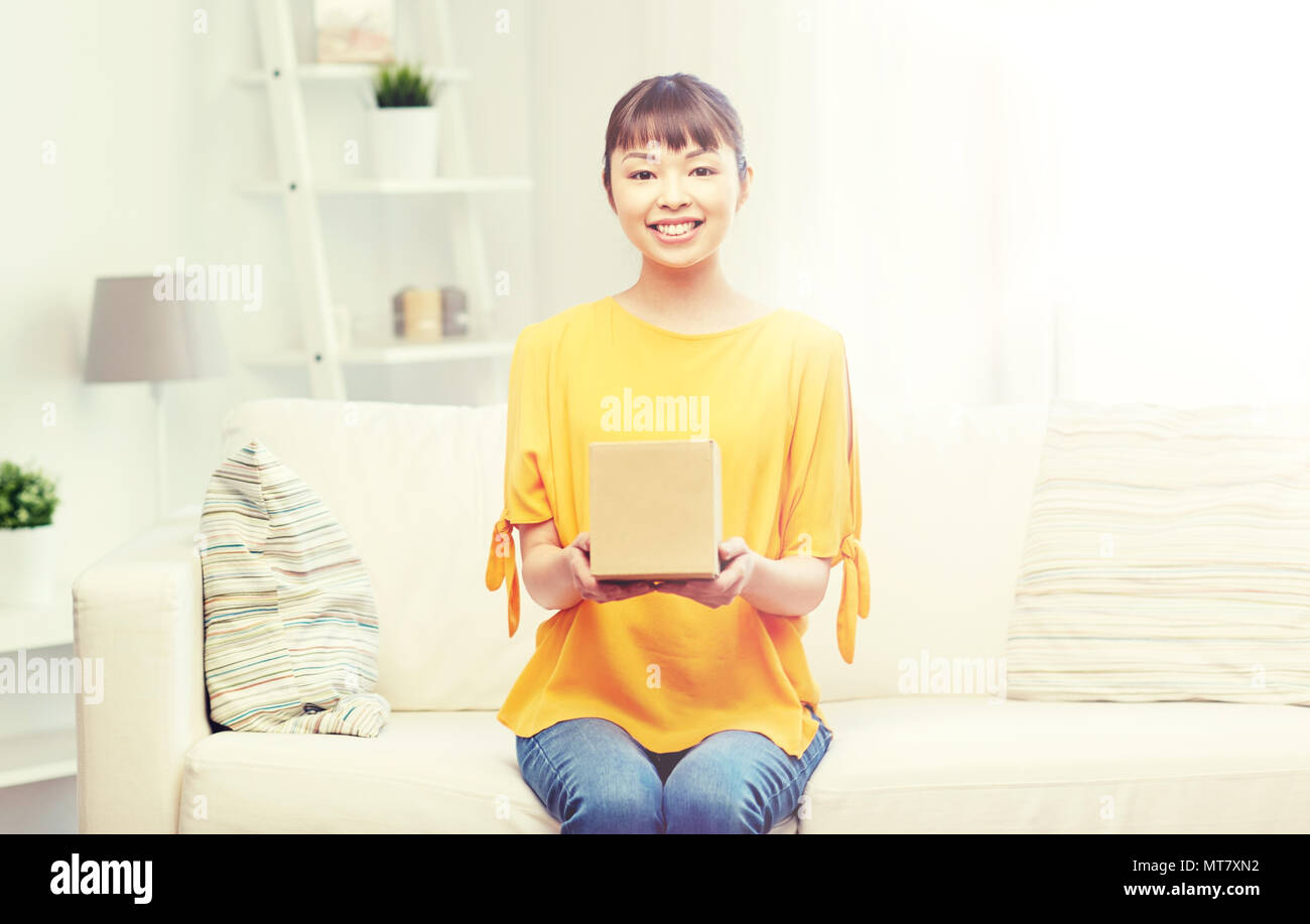 happy asian young woman with parcel box at home Stock Photo - Alamy