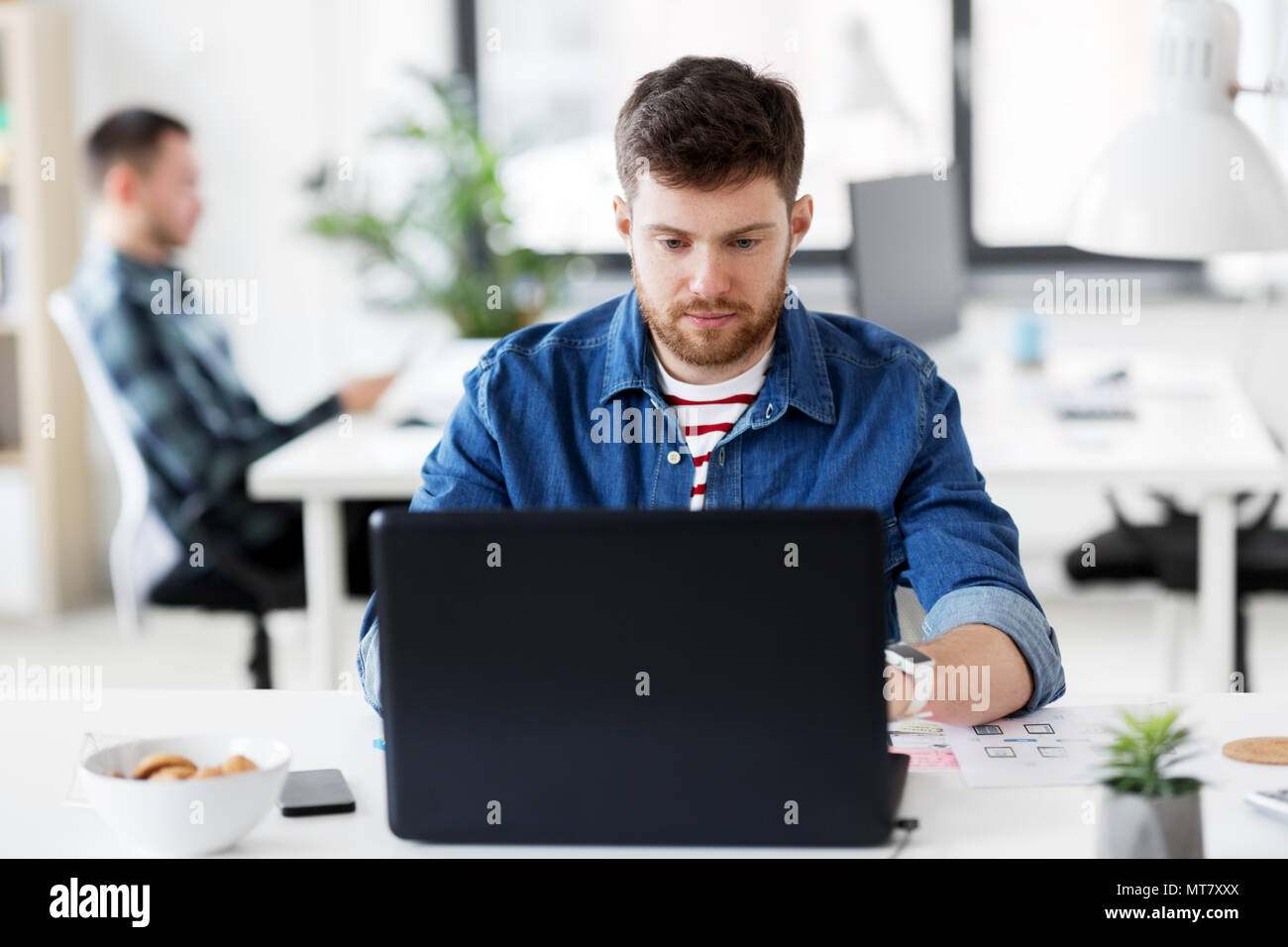 Young man designer jeans hi-res stock photography and images - Alamy