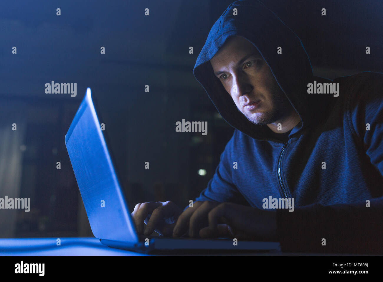hacker using laptop computer for cyber attack Stock Photo