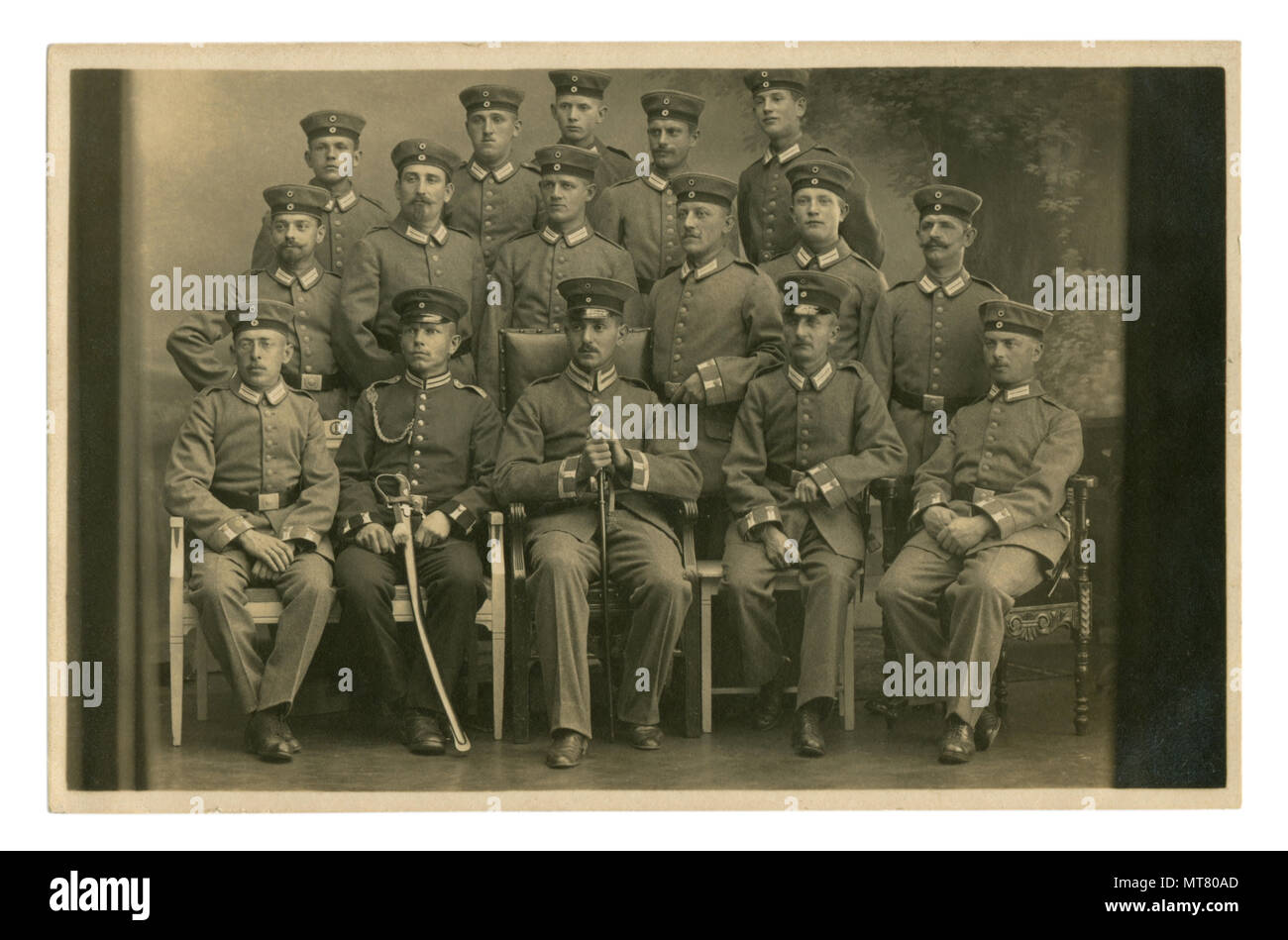 German historical photo: group portrait of a military unit, soldiers and the officer with a saber and second class iron cross ribbon. world war one Stock Photo
