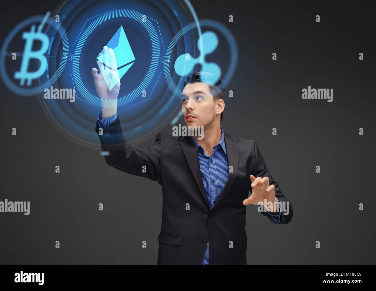 businessman with cryptocurrency holograms Stock Photo