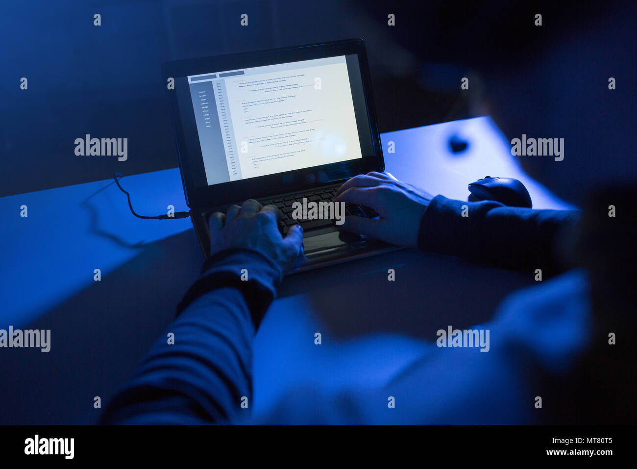 hacker using laptop for cyber attack Stock Photo