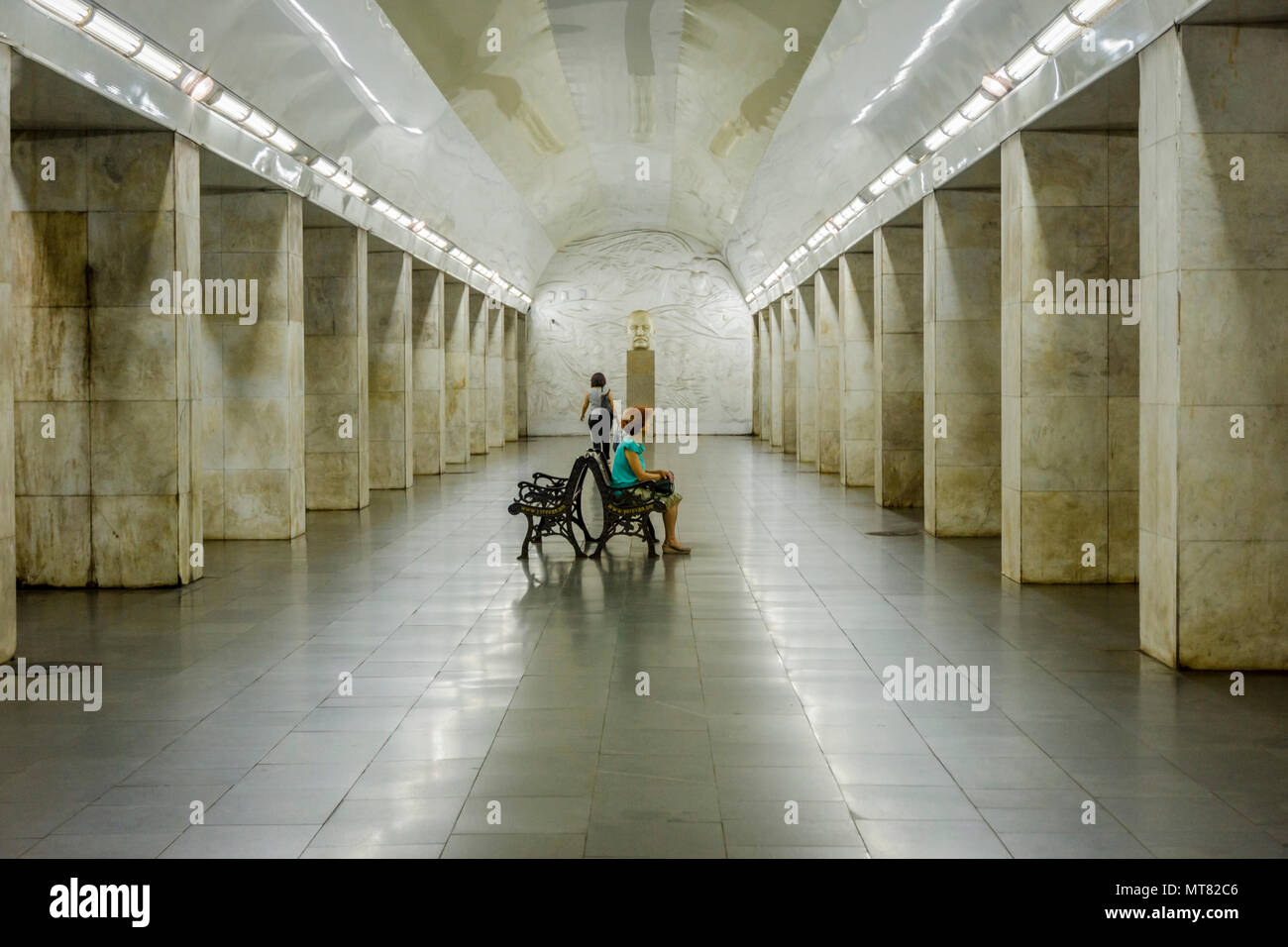 YEREVAN, ARMENIA AUGUST 8 Woman sitting on a bench and waiting for
