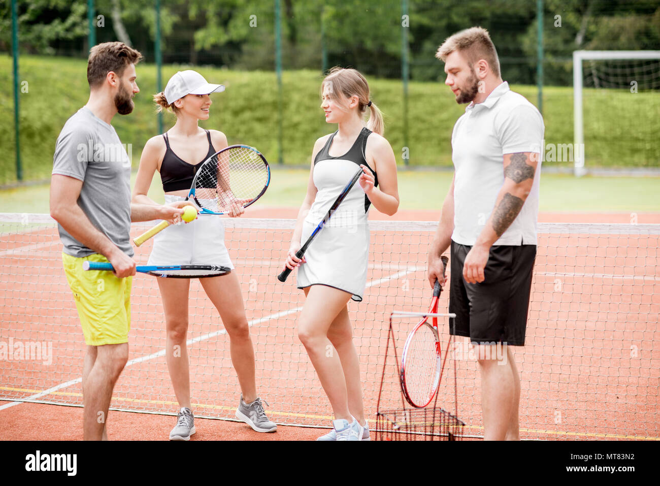 Friends on the tennis court Stock Photo Alamy