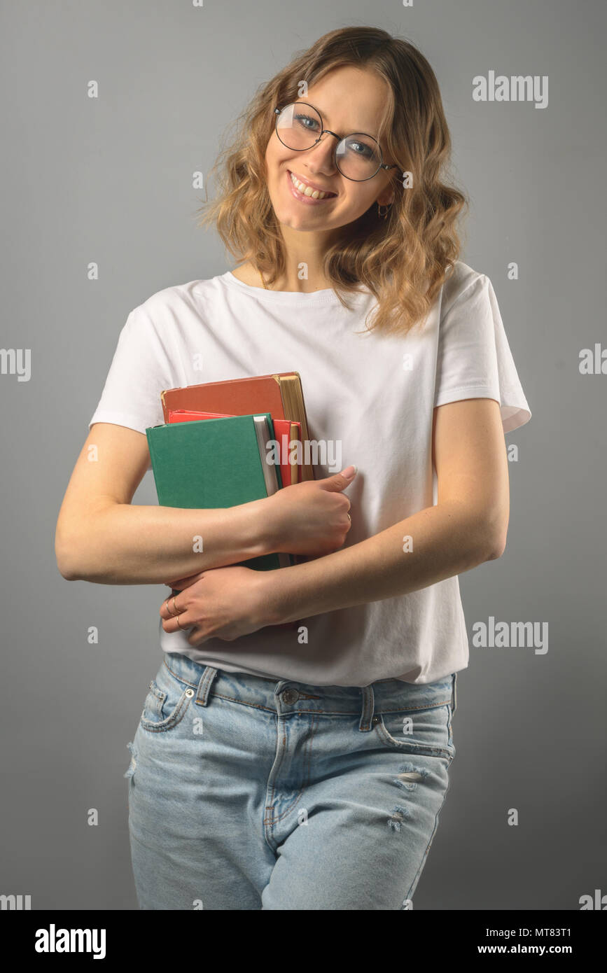 Girl with a book in glasses.  Stock Photo