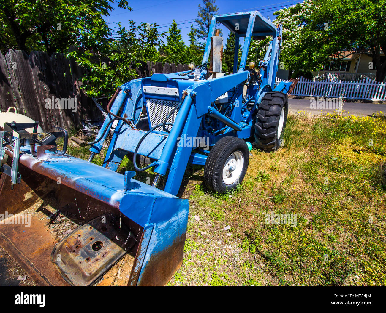 Blue Tractor With Front Scoop & Backhoe Stock Photo Alamy