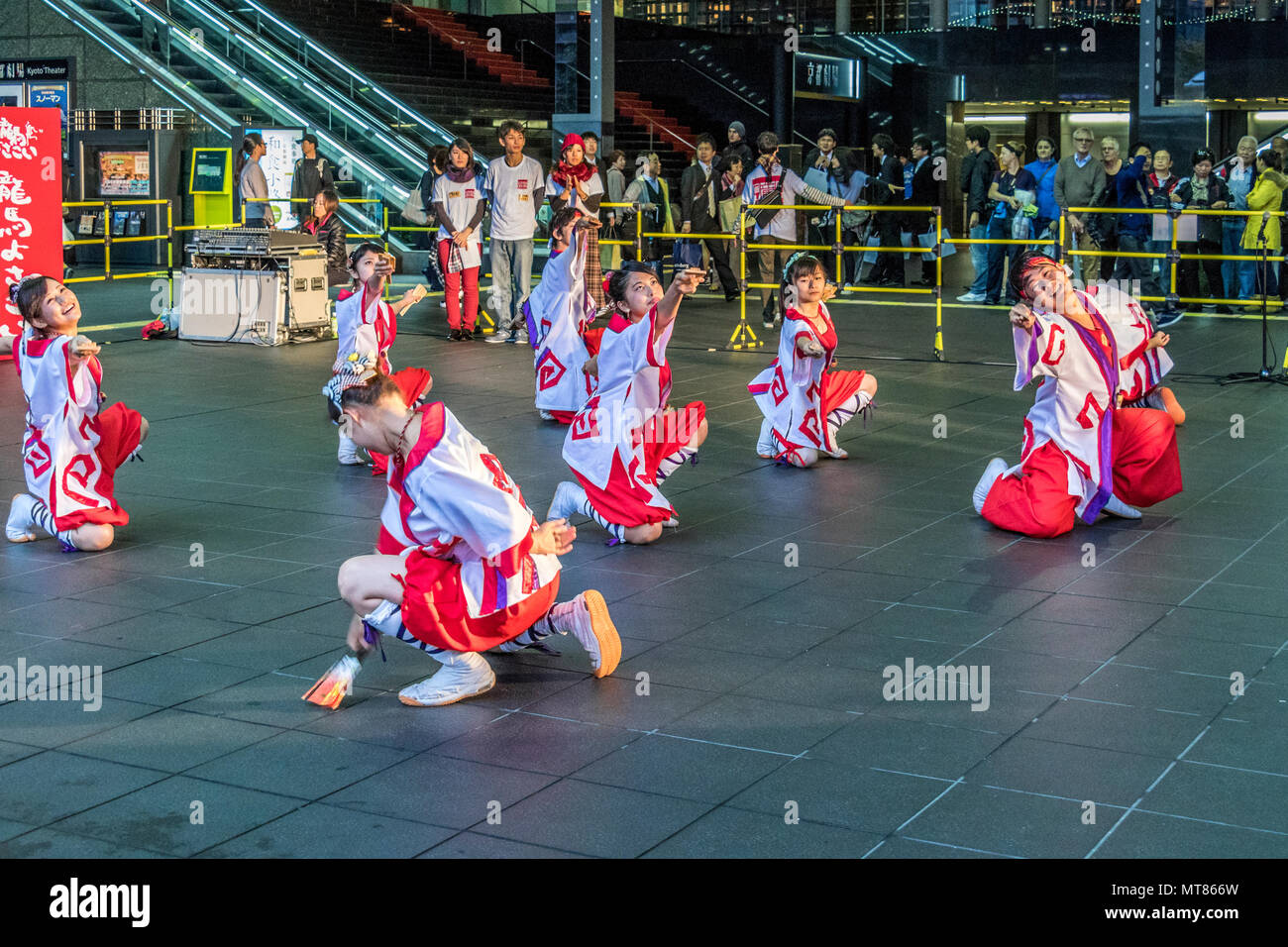 Japanese dancers performing yosakoi dance around Kyoto railway station