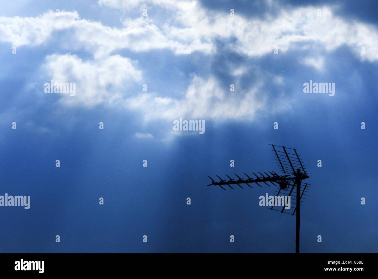 1988 HISTORICAL TELEVISION ANTENNAE UNDER STORMY SKY Stock Photo