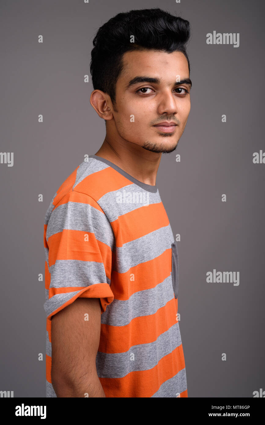 [Image: young-indian-man-against-gray-background-MT86GP.jpg]