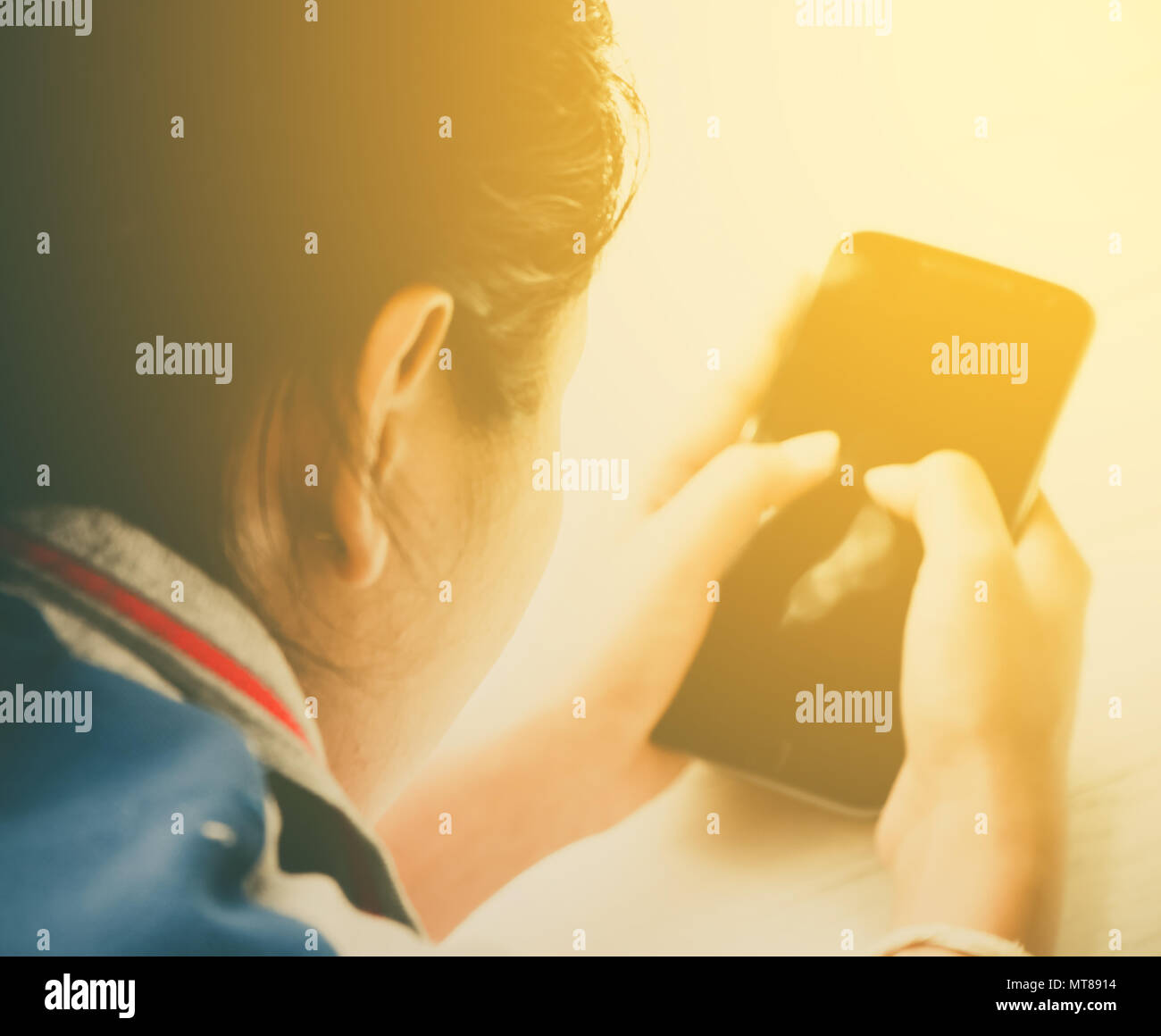 Women hand holding a smart phone Stock Photo