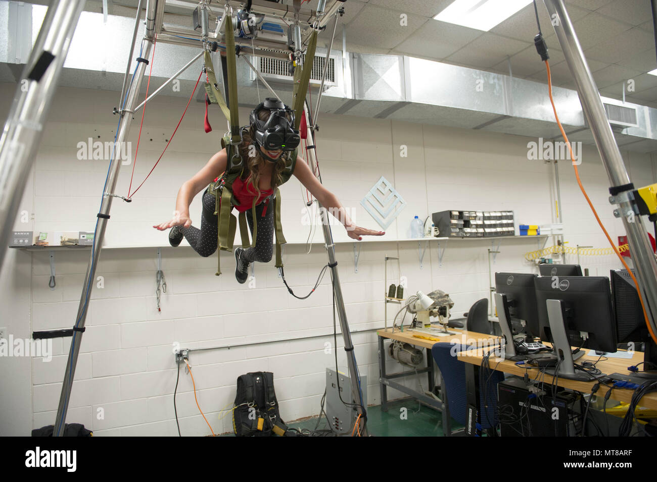 Ashley, a Tampa Bay Buccaneers cheerleader, experiences freefall in the MC-60 parachute simulator at the parachute rigging facility while visiting MacDill Air Force Base in Tampa, Fla., Nov. 7, 2017. The cheerleaders toured U.S Special Operations Command and other base facilities to meet with service members and to get a glimpse of military life. (Photo by Army Sgt. Jose Reyes) Stock Photo